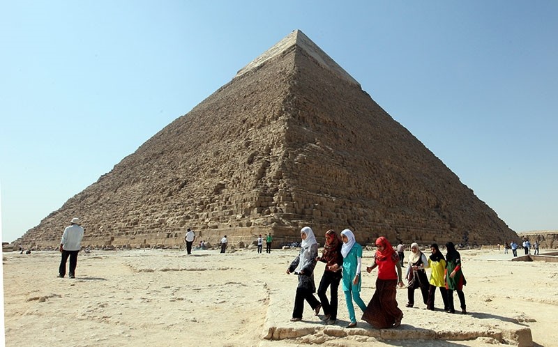 Egyptians students walk around the Pyramid of Khafre, in Giza, Egypt. (EPA Photo)