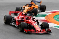 Ferrari's Kimi Raikkonen and McLaren's Fernando Alonso during practice in Monza, Aug. 31.