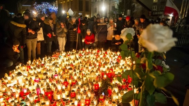 People place candles as they mourn the mayor of Gdansk, Pawel Adamowicz, Gdansk, Poland, Jan. 14.