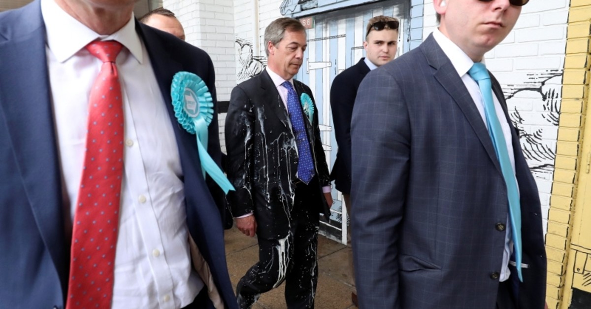 Brexit Party leader Nigel Farage gestures after being hit with a milkshake while arriving for a Brexit Party campaign event in Newcastle, Britain, May 20, 2019. (REUTERS Photo)