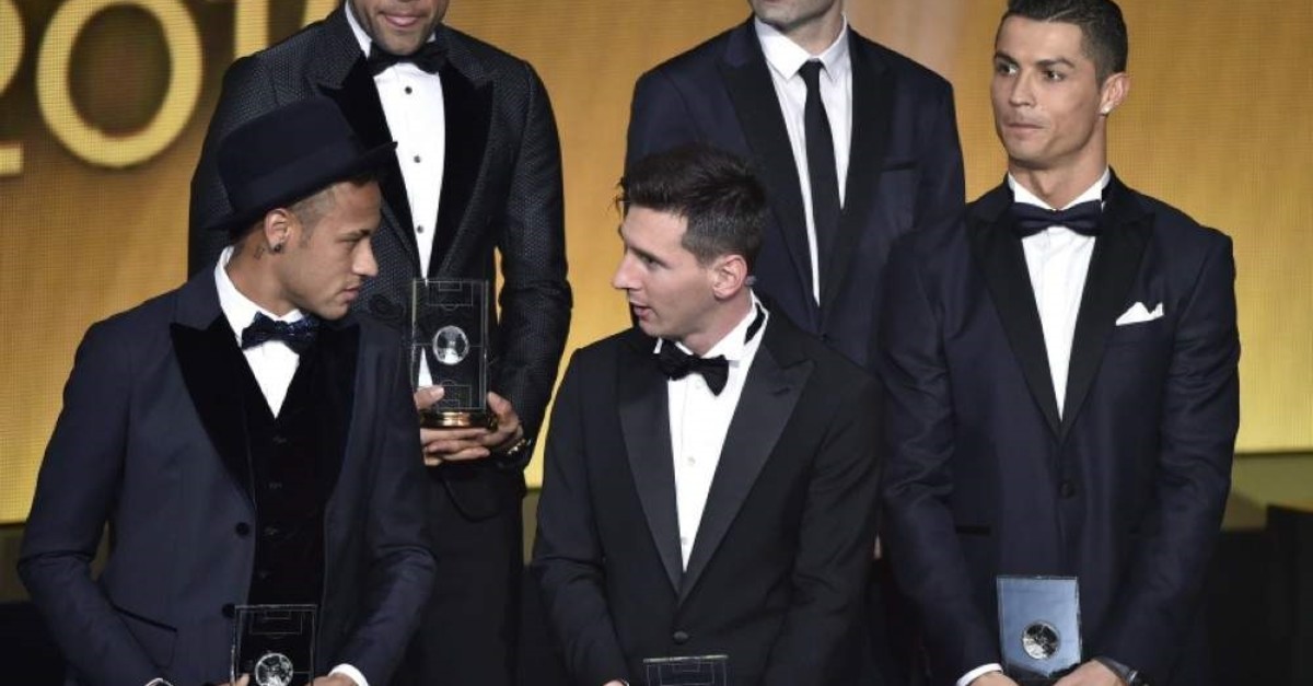 Neymar, Lionel Messi, and Portugal and Cristiano Ronaldo pose on stage after being selected in the 2015 FIFA FIFPro World XI during the 2015 FIFA Ballon d'Or award ceremony. (AFP Photo)