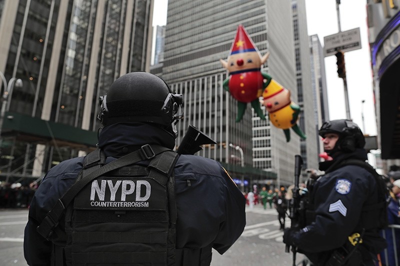 In this Nov. 24, 2016, file photo, New York Police counterterrorism personnel watch as the Macy's Thanksgiving Day parade makes its way down Sixth Avenue in New York (AP Photo)