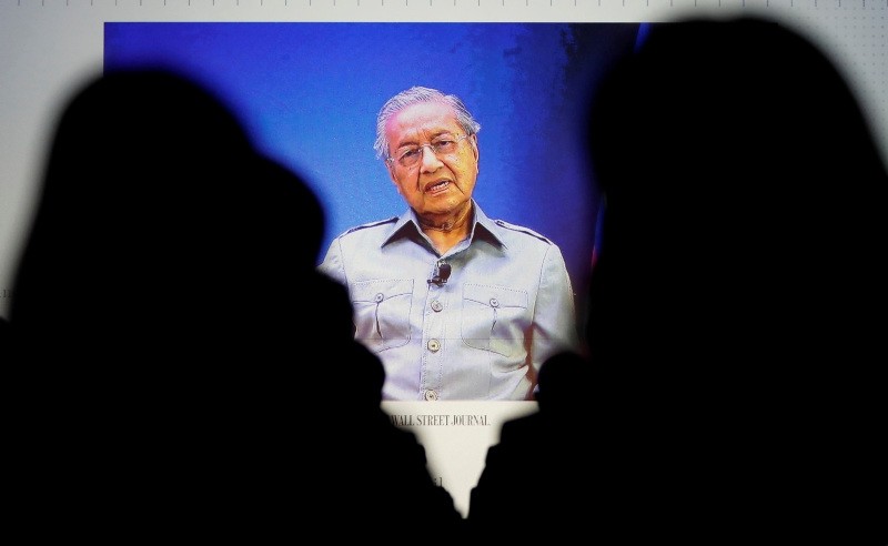 Malaysia's Prime Minister Mahathir Mohamad is seen on video conference screen during the Wall Street Journal CEO Conference in Tokyo, Japan May 15, 2018.  (REUTERS Photo)