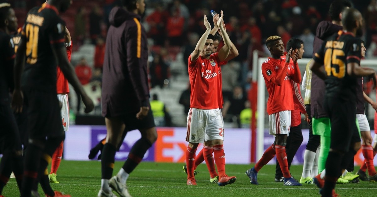 Benfica players applaud fans at the end of match as Galatasaray players walk by, Feb. 21, 2019.