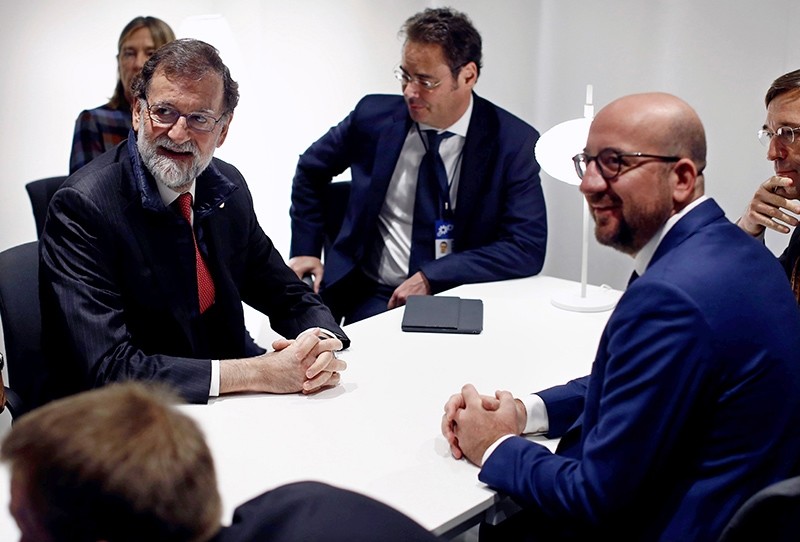 A handout photo made available by the Spanish Prime Minister's Office showing Spanish Prime Minister, Mariano Rajoy (L), meeting his Belgian counterpart, Charles Michel (R), Gothenburg, Sweden, Nov. 17, 2017. (via EPA) 
