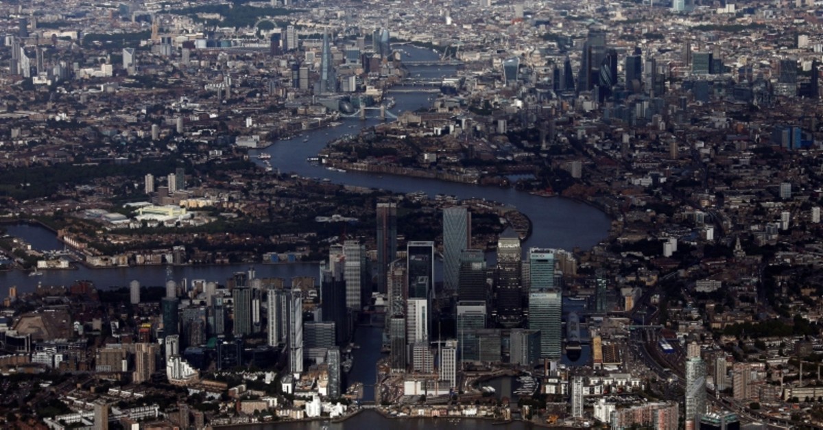 Canary Wharf and the City of London financial district are seen from an aerial view in London, Britain, August 8, 2019. (Reuters Photo)