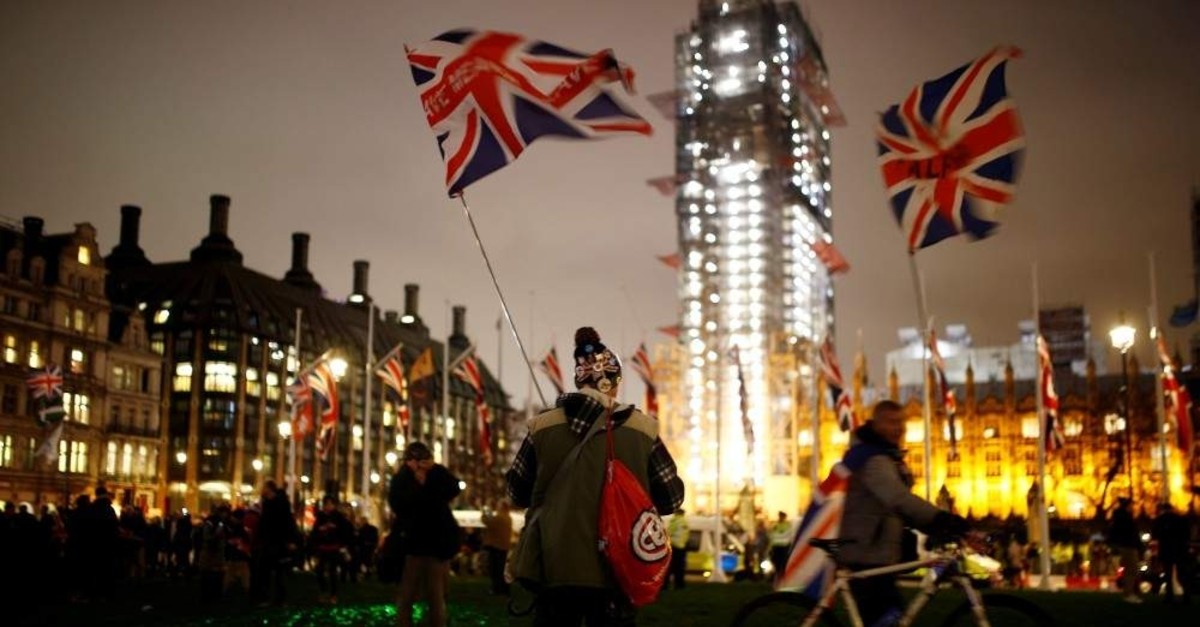 People celebrate Britain leaving the EU on Brexit day in London, Jan. 31, 2020. (REUTERS Photo)