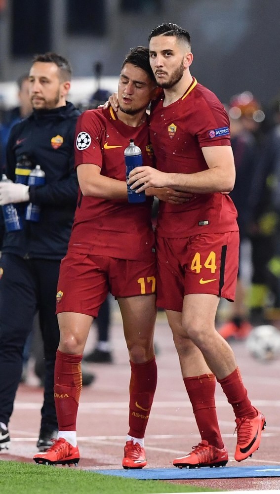 Roma's Kostas Manolas (R) celebrates with teammate Cengiz u00dcnder after scoring the key third goal during the UEFA Champions League quarter final second leg match at the Olimpico Stadium in Rome.