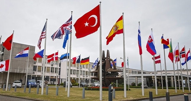 Flags of NATO member countries fly in front of its headquarters in Brussels, Belgium, July 28, 2015.