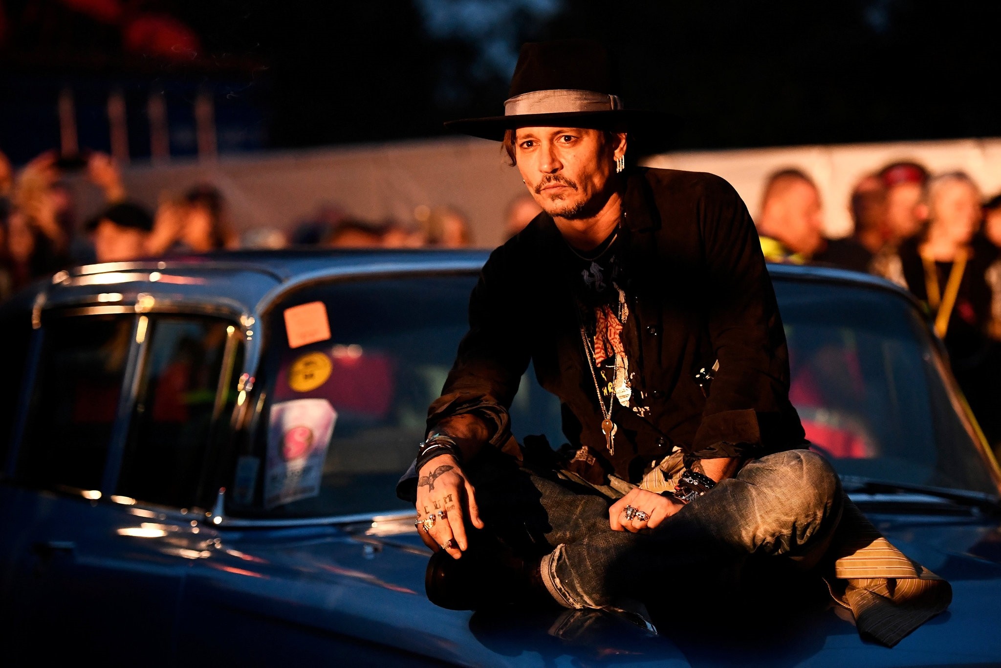 Actor Johnny Depp poses on a Cadillac before presenting his film The Libertine, at Cinemageddon at Worthy Farm in Somerset during the Glastonbury Festival in Britain, June 22, 2017. (REUTERS Photo)