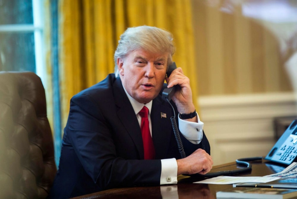 U.S. President Donald Trump speaks on the phone with the King of Saudi Arabia, Salman bin Abdulaziz Al Saud, in the Oval Office in Washington, D.C., Jan. 29.