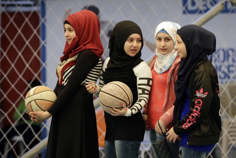 Syrian refugee girls attend a basketball training session at a private sports club, southern Beirut.