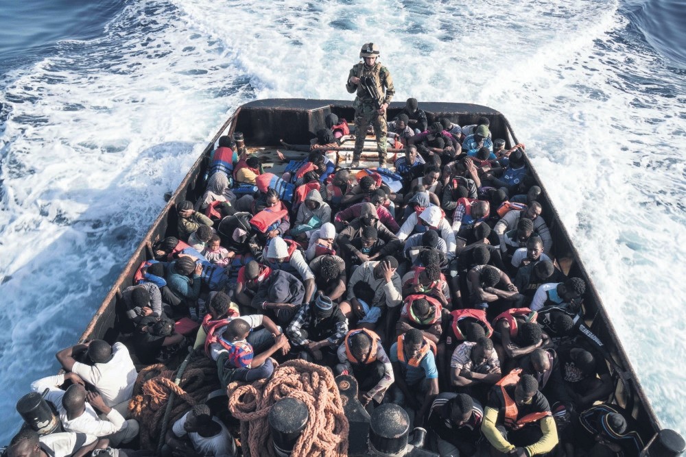 A Libyan coast guardsman stands on a boat during the rescue of 147 illegal immigrants attempting to reach Europe off the coastal town of Zawiyah, 45 kilometres west of the capital Tripoli, Libya, June 27.