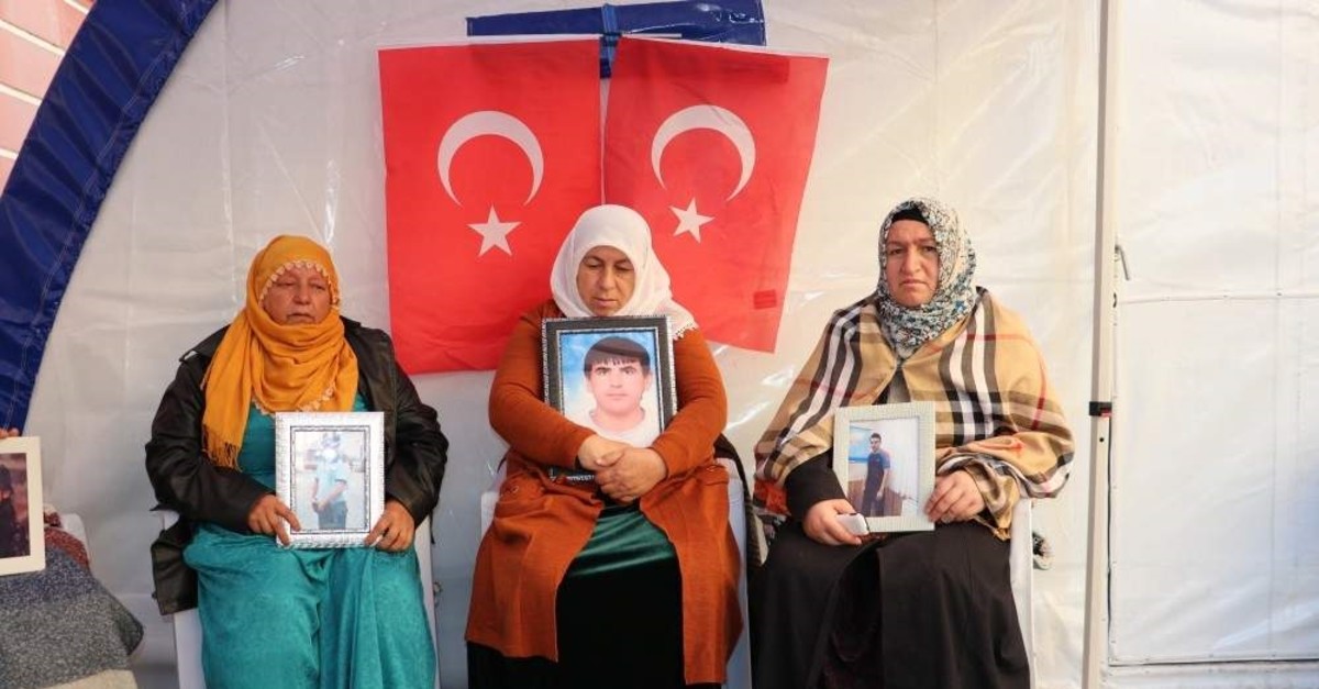 Mothers hold pictures of their children abducted by the PKK terrorist group during a sit-in protest at the pro-PKK Peoples' Democratic Party (HDP) headquarters in Diyarbak?r, Nov.16, 2019. AA