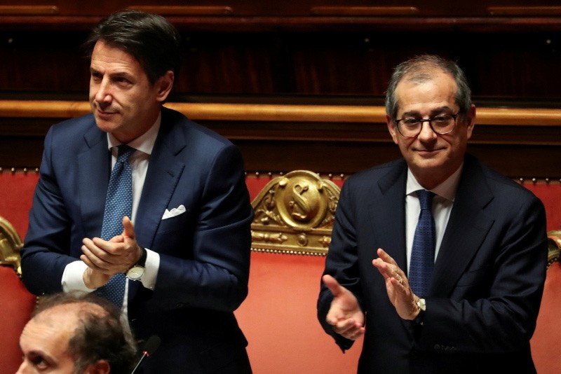 Italian Prime Minister Giuseppe Conte and Italian Economy Minister Giovanni Tria attend a debate at the Senate in Rome, Italy, Dec. 19, 2018. 