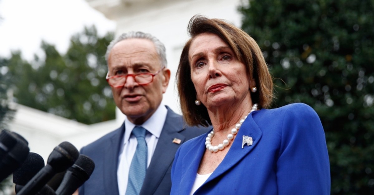 House Speaker Nancy Pelosi of Calif., right, speaks with members of the media alongside Senate Minority Leader Sen. Chuck Schumer of N.Y., after a meeting with President Donald Trump, Wednesday, Oct. 16, 2019, in Washington. (AP Photo)