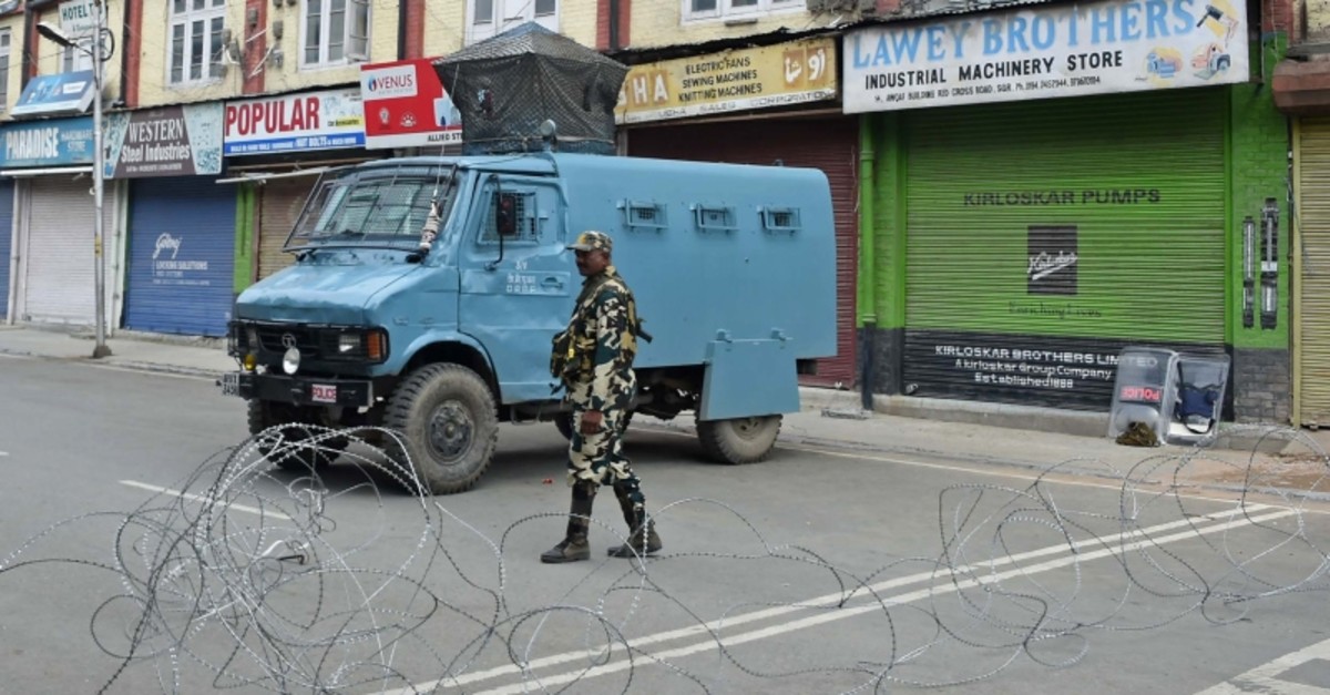 A member of the Indian security forces stands guard during a lockdown in Srinagar on August 16, 2019, after the Indian government stripped Jammu and Kashmir of its autonomy. (AFP Photo)