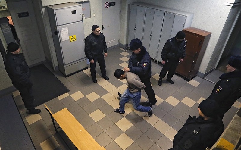 A man suspected in involvement in organizing St. Petersburg metro blast is escorted inside the Oktyabrsky district court in St. Petersburg, Russia, 07 April 2017. (EPA Photo)