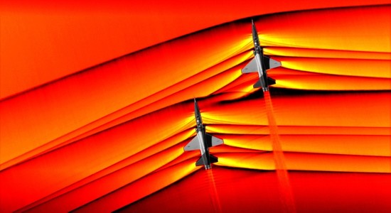This handout colorized composite image released by NASA on February 7, 2019 shows two T-38 aircrafts flying in formation at supersonic speeds producing shockwaves that are typically heard on the ground as a sonic boom. (AFP Photo)