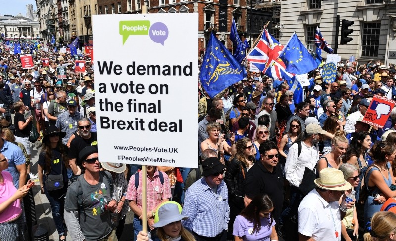 Tens of thousands of people march through London during a People's March anti-Brexit demonstration, in London, Britain, 23 June 2018. (EPA Photo)