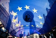 Protesters transport an inflated globe and a flag of the European Union through the streets during a demonstration, Muenster, northwestern Germany, May 24, 2019.
