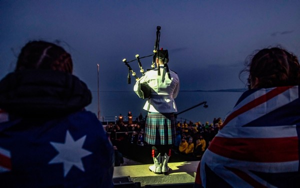 Army officers observe a minute of silence during a Dawn Service ceremony at Anzac Cove Beach, at Canakkale on the Gallipoli Peninsula early April 25, 2019, marking the 104th anniversary of the World War I landing of the ANZACs. (AFP Photo)