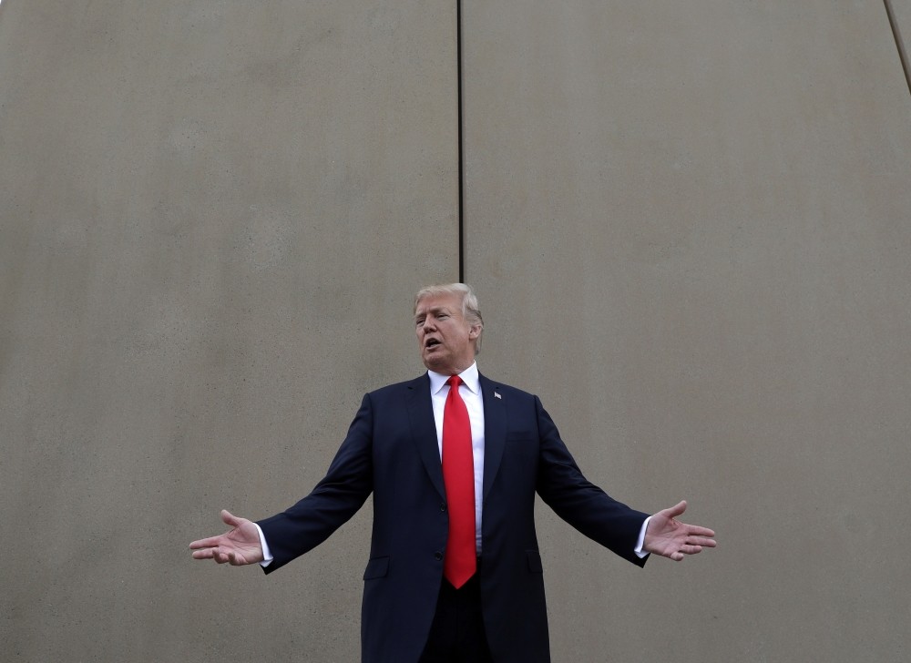 U.S. President Donald Trump speaks during a tour as he reviews border wall prototypes in San Diego, March 13.