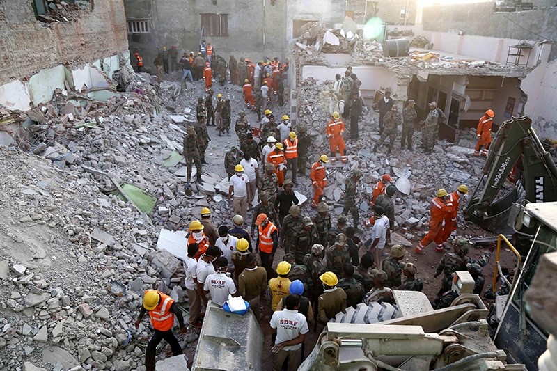 Indian Army, NDRF and SDRF personnel carry out rescue work after a building collapsed due to a gas cylinder blast during wedding party in Beawar, in the Indian state of Rajasthan (AFP Photo)