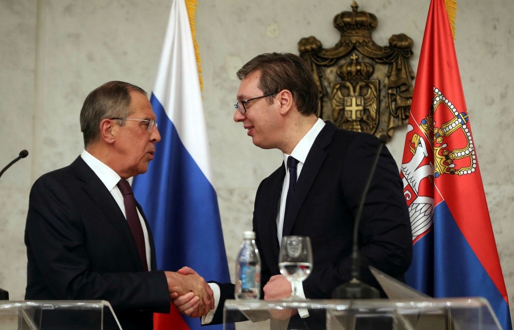 Russian Foreign Minister Sergei Lavrov (L) shakes hands with Serbian President Aleksandar Vucic (R), Belgrade, Feb. 21.