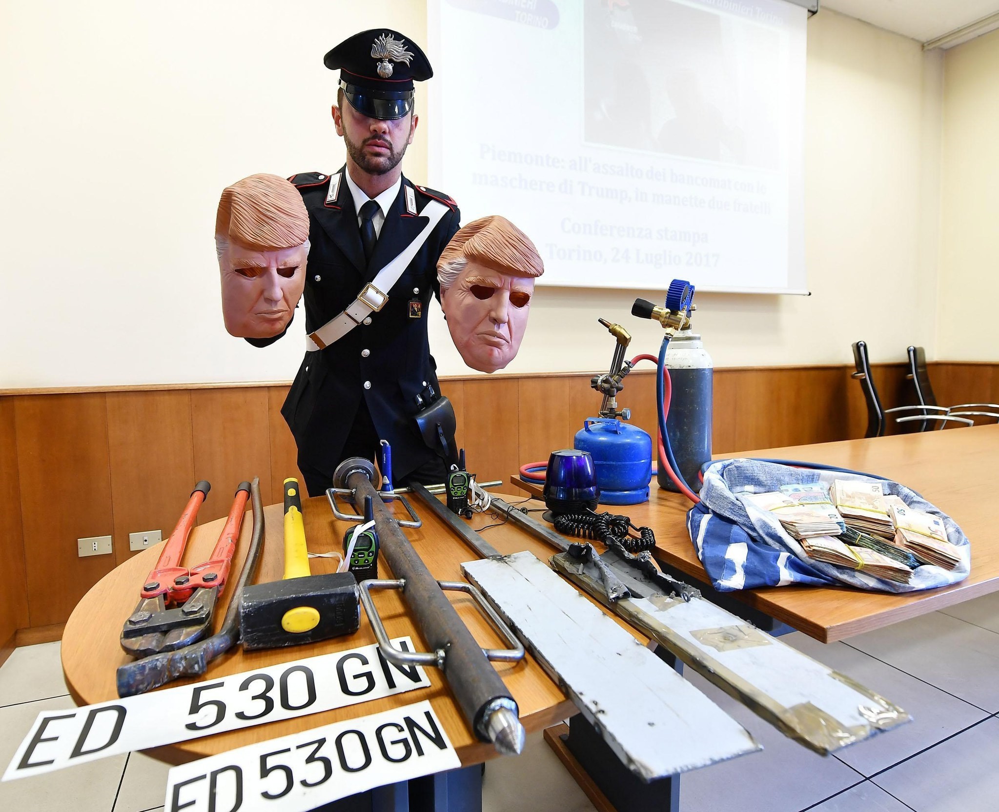 Masks of US President Donald J. Trump used by two alleged thieves are displayed by Italian Carabinieri police during a press conference in Turin, northern Italy, 24 July 2017. (EPA Photo)