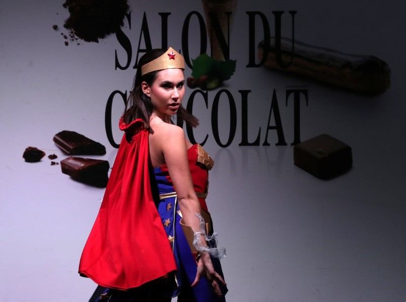 A model dressed in an outfit made with chocolate presents a creation at the