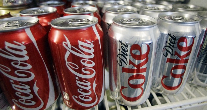 In this March 17, 2011, file photo, cans of Coca-Cola and Diet Coke sit in a cooler in Anne's Deli in Portland, Ore. (AP Photo)