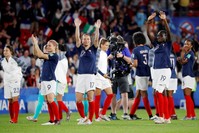 France's Eugenie Le Sommer, Gaetane Thiney and Griedge Mbock Bathy celebrate victory against Nigeria, June 17, 2019.