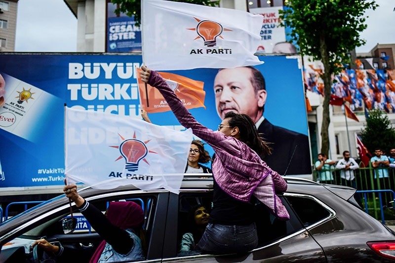 People react outside the Justice and Development Party (AK Party) headquarters in Istanbul, on June 24, 2018, during the Turkish presidential and parliamentary elections. (AFP Photo)