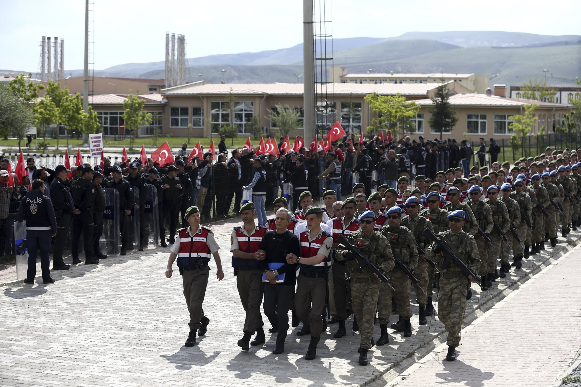 Turkish Gendarmerie escort suspects involved in last Julyu2019s attempted coup in Turkey as they leave the prison ahead of their trial in Ankara, on May 22, 2017. (AA Photo)