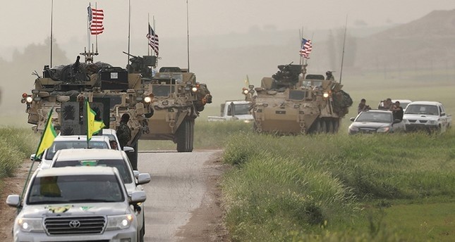 Terrorists from the People's Protection Units (YPG) head a convoy of U.S military vehicles in the town of Darbasiya next to the Turkish border, Syria April 28, 2017. (Reuters Photo)