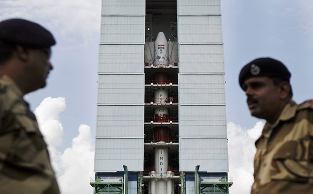 Central Industrial Security Force (CISF) personnel stand guard near the Polar Satellite Launch Vehicle at Sriharikota, in the southern Indian state of Andhra Pradesh. (AP File Photo)