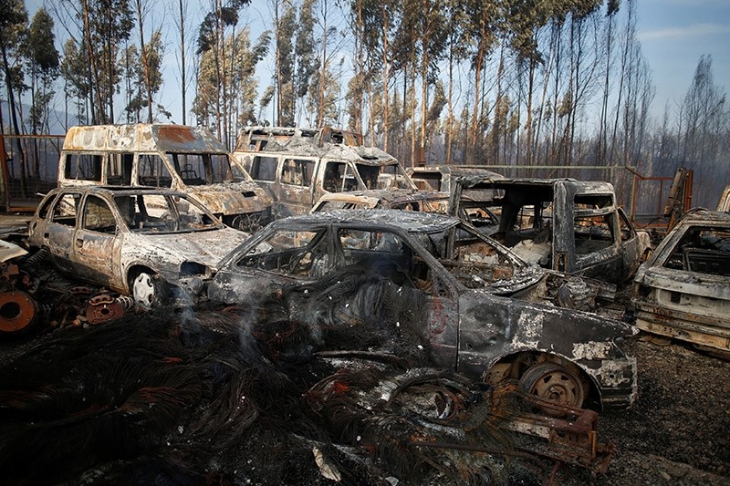 Burnt vehicles are seen after a forest fire in Miro, near Penacova, Portugal,  October 17, 2017. (Reuters Photo)