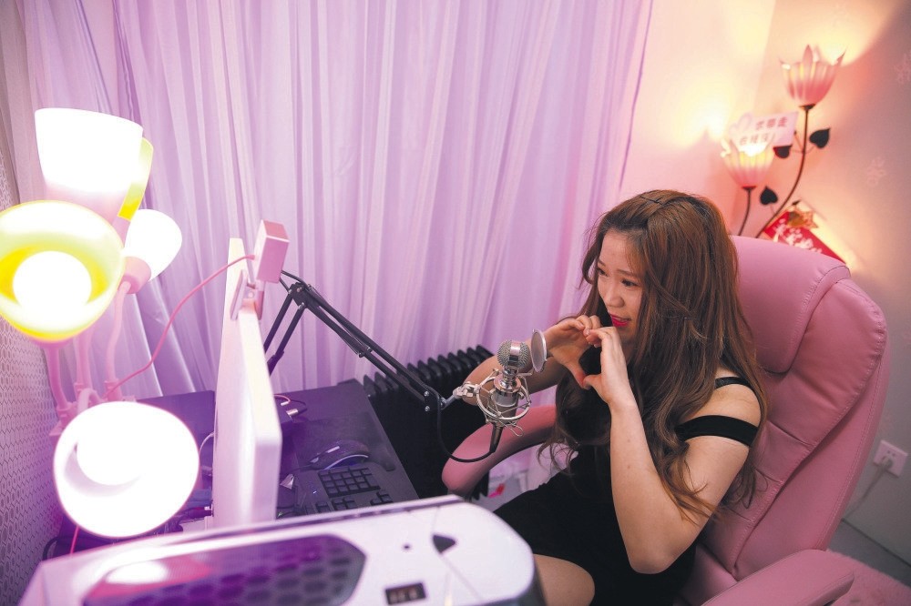 A girl broadcasts at live streaming talent agency Three Minute TV in Beijing, China. (Reuters Photo)
