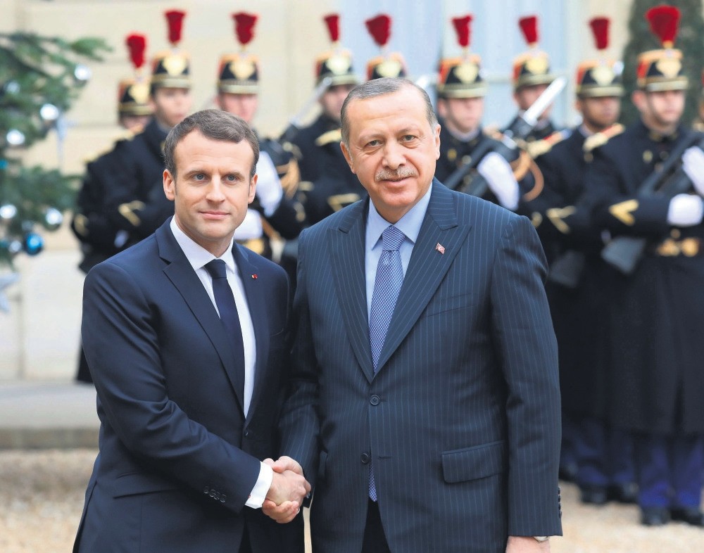 President Recep Tayyip Erdou011fan is welcomed by French counterpart Emmanuel Macron upon his arrival for their meeting and luncheon at the Elysee Palace, Paris, Jan. 5.