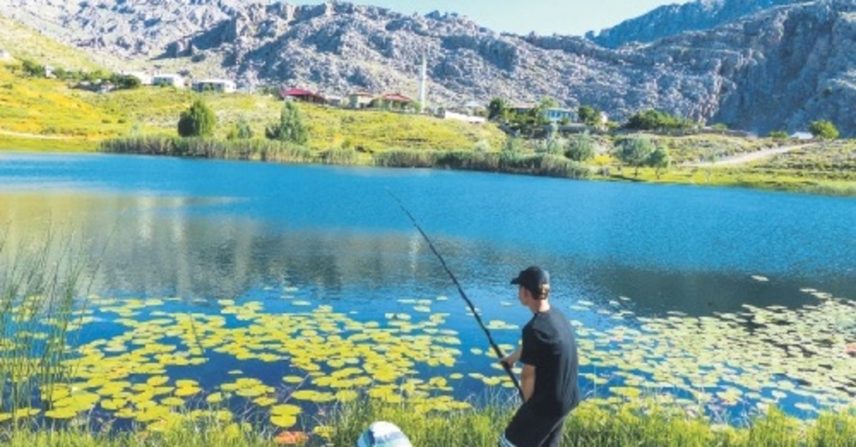 Two youngsters fish at Lake Dipsiz, located between Konya and Antalya provinces.