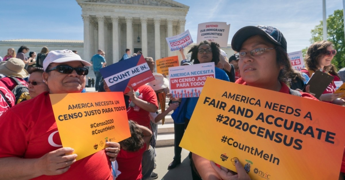 In this April 23, 2019 file photo, immigration activists rally outside the Supreme Court as the justices hear arguments over the Trump administration's plan to ask about citizenship on the 2020 census, in Washington. (AP Photo)