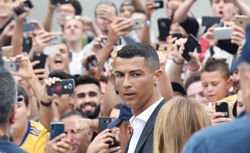 New Juventus soccer player Cristiano Ronaldo (C) of Portugal arrives at Juventus J Medical in Turin, Italy, 16 July 2018. (EPA Photo)
