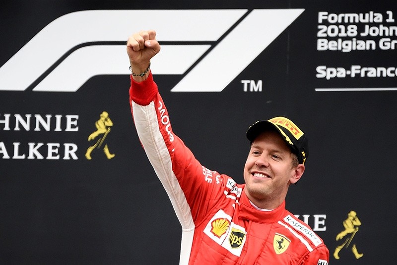 Winner Ferrari's German driver Sebastian Vettel celebrates on the podium after the Belgian Formula One Grand Prix at the Spa-Francorchamps circuit in Spa on Aug. 26, 2018. (AFP Photo)