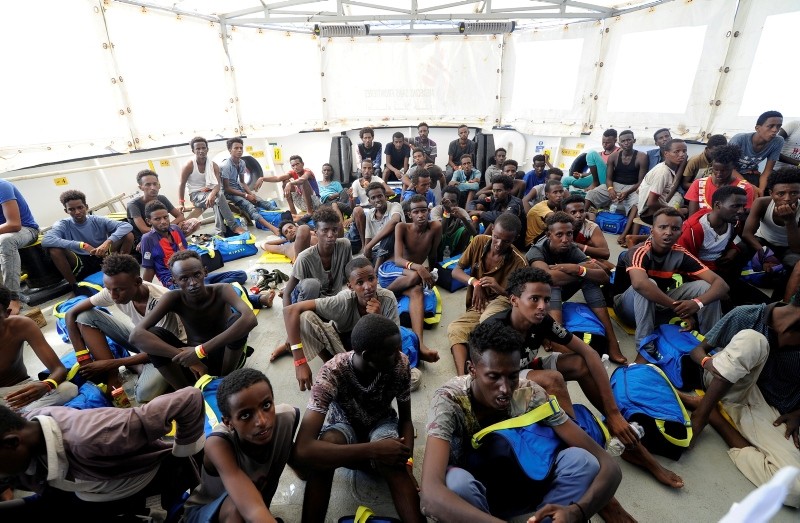 Migrants rest after being rescued by SOS Mediterranee organisation and Doctors Without Borders during a search and rescue (SAR) operation with the MV Aquarius rescue ship in the Mediterranean Sea, August 10, 2018. (REUTERS Photo)