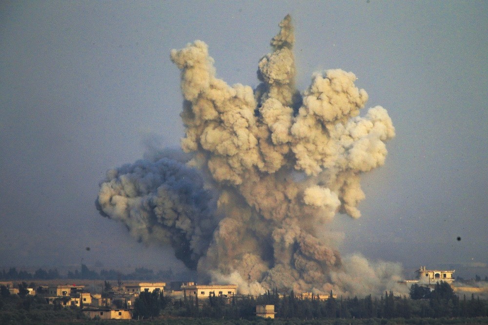 Smoke and explosions from the fighting between Assad regime forces and opposition groups, southern Syria. 