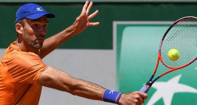 Croatia's Karlovic becomes oldest man to win match at Roland Garros for 46 years