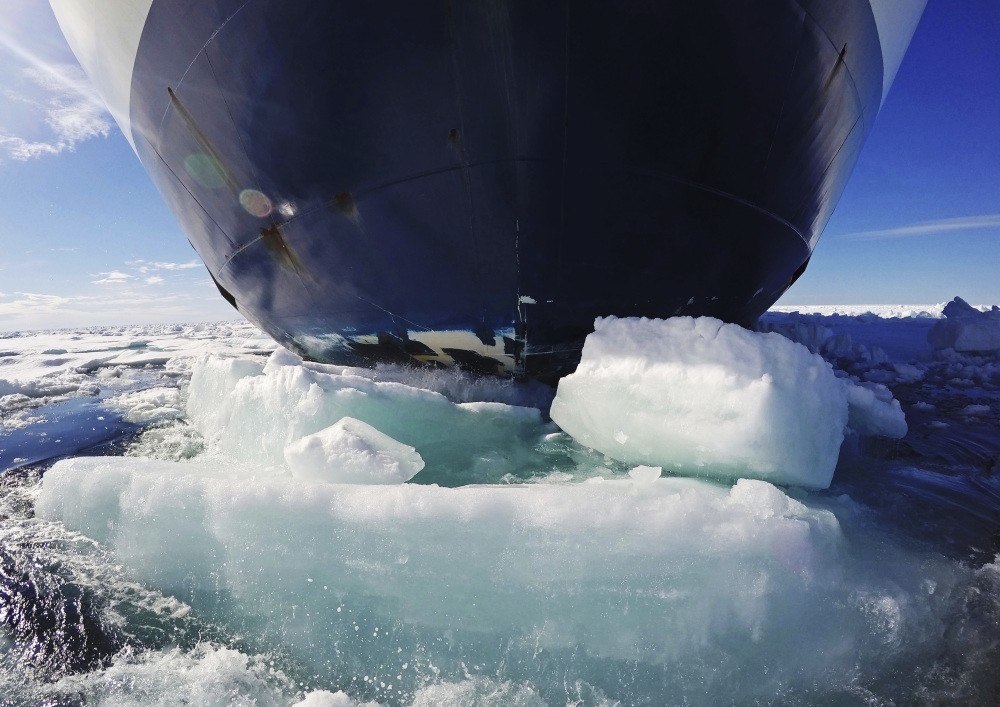 The bow of the Finnish icebreaker MSV Nordica pushes down sea ice as it traverses the Arctic's Northwest Passage through the Canadian Arctic Archipelago.