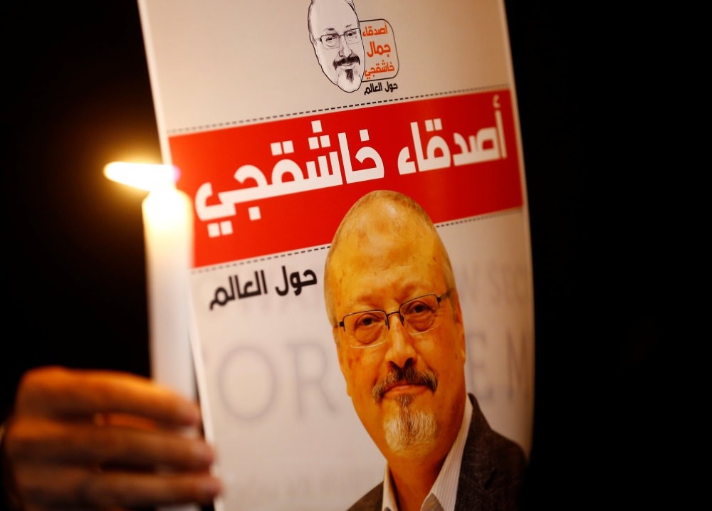 A demonstrator holds a poster with a picture of Saudi journalist Jamal Khashoggi outside the Saudi Consulate in Istanbul, Oct. 25.
