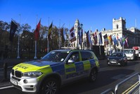 A police car drives past Parliament Square, ahead of the NATO summit in London, Dec. 2, 2019. (AP PHOTO)